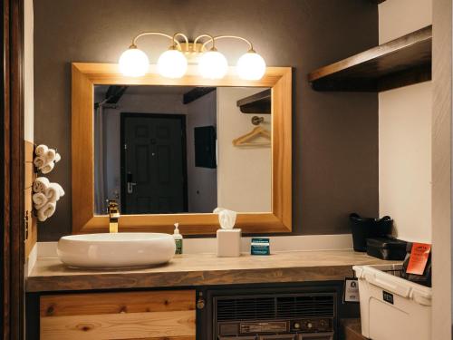 a bathroom with a sink and a mirror at LOGE Bend in Bend