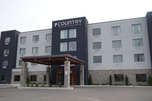 a rendering of the front of a building at Country Inn & Suites by Radisson, Belleville, ON in Belleville