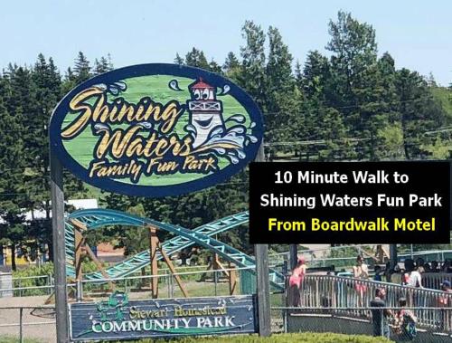 a sign for a water park with a roller coaster at Boardwalk Motel in Cavendish