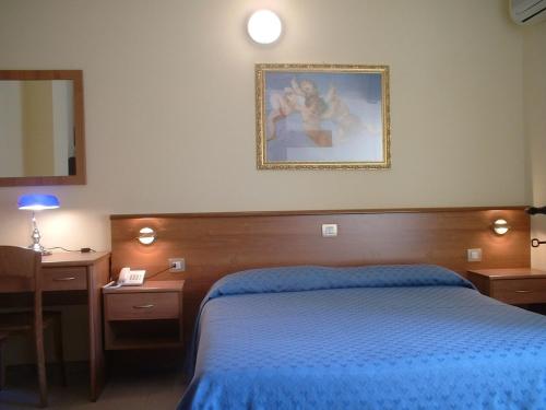 Postel nebo postele na pokoji v ubytování Hotel Il Vulcano