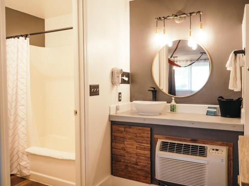 a bathroom with a sink and a mirror at LOGE Bend in Bend