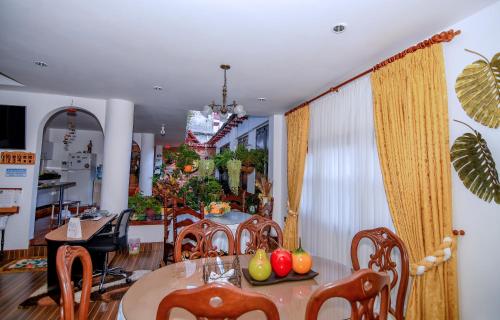 a dining room with a table and chairs at HOTEL LA CASONA SAN AGUSTIn in San Agustín
