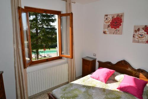 A bed or beds in a room at tenuta braccini