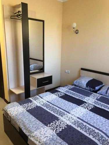 Ένα ή περισσότερα κρεβάτια σε δωμάτιο στο Mini-Hotel Tulpar