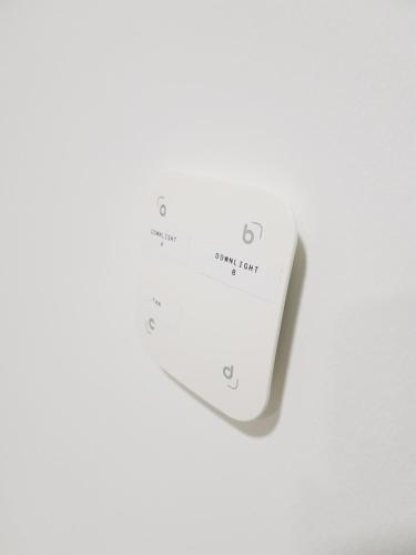 a white electronic device on a white background at SHAHALAM ALLBESS@TREFOIL in Setia Alam