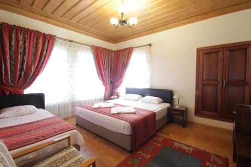 Katil atau katil-katil dalam bilik di Konya Dervish Hotel