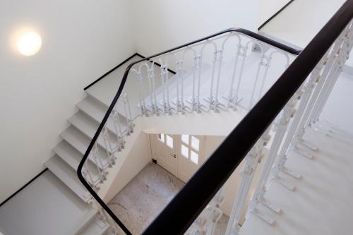 a glass stair case in a building at Urban Residences Maastricht in Maastricht