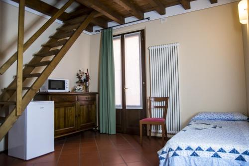En eller flere senge i et værelse på Agriturismo Lupo Bianco