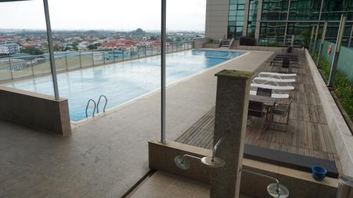 a swimming pool on the top of a building at Bernard Holiday Home 2 @ Boulevard Imperial Suite Kuching in Kuching
