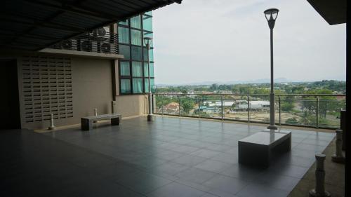 a large building with a balcony with a view at Bernard Holiday Home 2 @ Boulevard Imperial Suite Kuching in Kuching