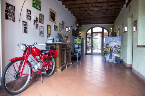 a red motorcycle is parked in a room at Agriturismo Lupo Bianco in Monzambano