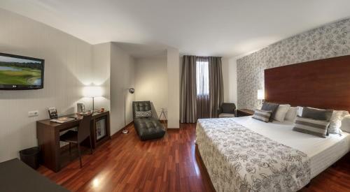Ein Bett oder Betten in einem Zimmer der Unterkunft Hotel Gran Ultonia