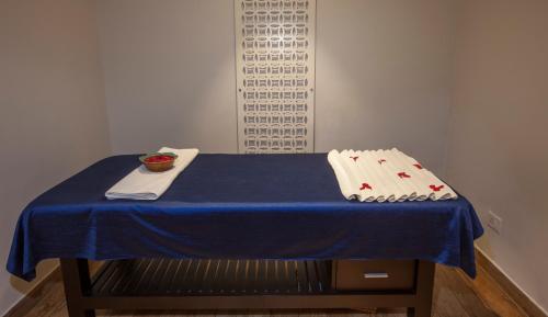 a table with a blue table cloth on it at Lemon Tree Premier, Patna in Patna