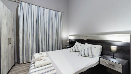 Ένα ή περισσότερα κρεβάτια σε δωμάτιο στο Paramithi Luxury Apartments