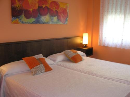 Ένα ή περισσότερα κρεβάτια σε δωμάτιο στο Hotel Entreviñes