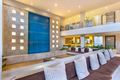 a bar in a hotel with a row of chairs at Bliss Resort in Nyali