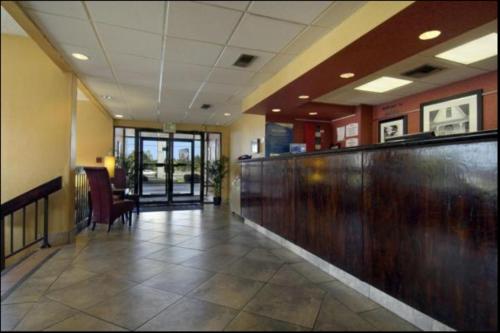 a very nice looking restaurant with a large window at Baymont by Wyndham Mobile/ I-65 in Mobile