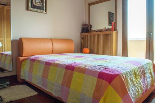 a bedroom with a bed with a colorful blanket at Luxury Villa Karteros in Karteros