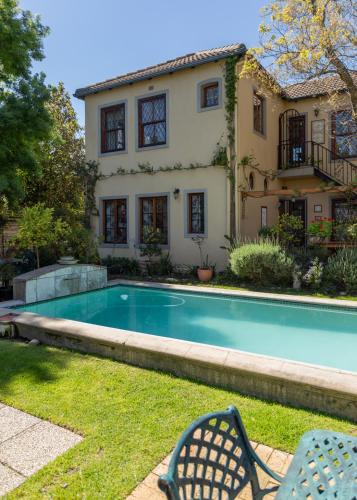 a house with a swimming pool in the yard at 10 Alexander B&B in Stellenbosch