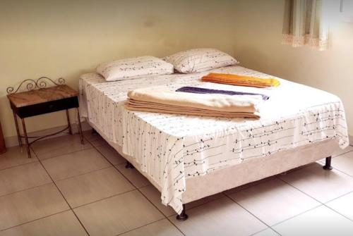 מיטה או מיטות בחדר ב-Hotel Real de Caeté