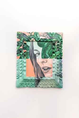 a painting of a woman with leaves on a wall at X.O Art House in Cusco