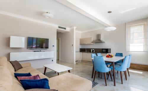 a living room with a couch and a table at Boka di Mare in Tivat