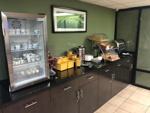 a kitchen with a refrigerator with food in it at Days Inn by Wyndham Brooklyn Borough Park in Brooklyn