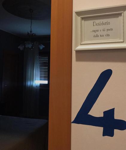 a door with a sign that reads disasteragentagentagent ok per drink per year at Hotel Opera' in Moscufo