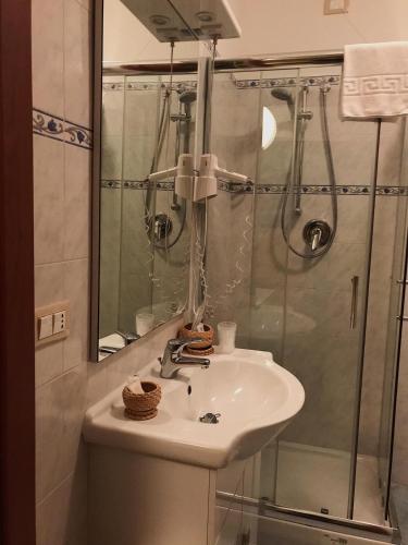 a bathroom with a sink and a shower at Hotel Opera' in Moscufo