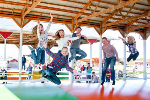 a group of people jumping in the air on a trampoline at Orr Family Farm & RR, LLC in Oklahoma City