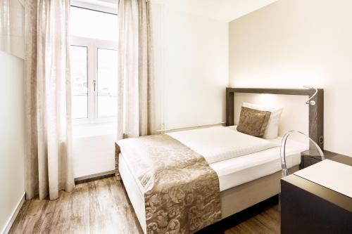 Postel nebo postele na pokoji v ubytování Hotel Schäfli