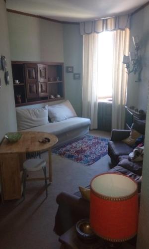 a living room with a bed and a table at bilocale Giomein in Breuil-Cervinia