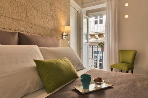 Postel nebo postele na pokoji v ubytování Sciala Ortigia B&B