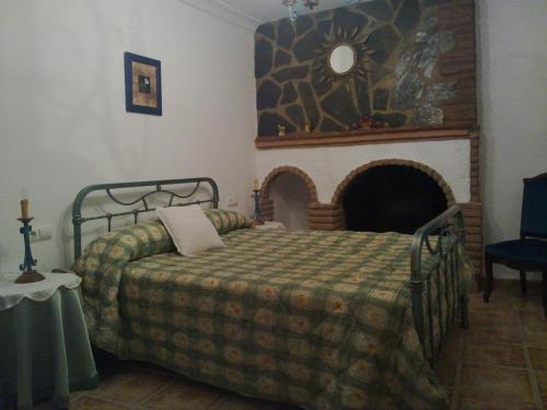 Ένα ή περισσότερα κρεβάτια σε δωμάτιο στο Casas Cueva Paloma