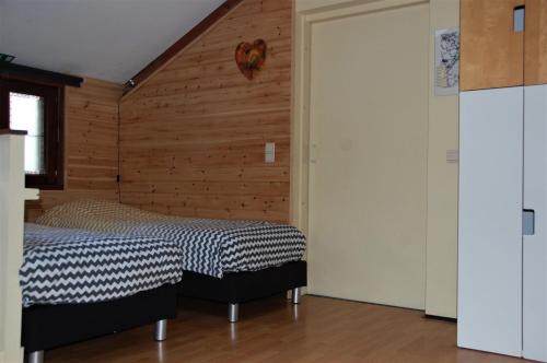 Een bed of bedden in een kamer bij Vakantiestudio 'Kleine Johannes'