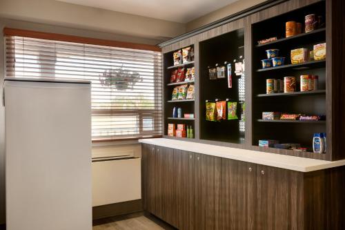a kitchen with a counter and a large window at Travelodge Suites by Wyndham New Glasgow in New Glasgow
