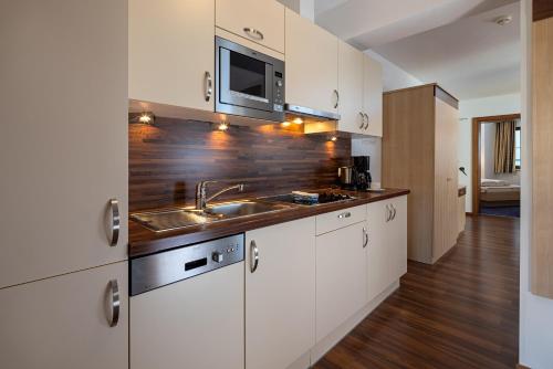 Kuchyň nebo kuchyňský kout v ubytování Apart-Hotel Aurora Fiss