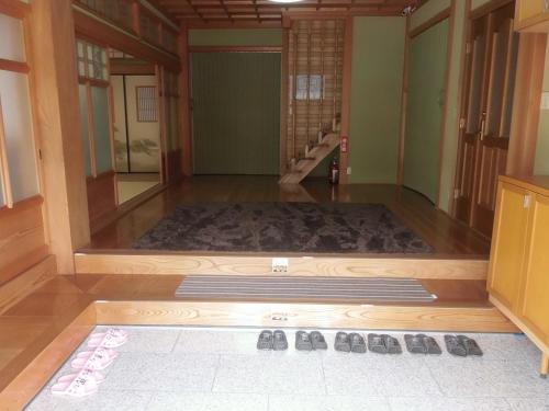 a room with a large rug on the floor at Minpaku Nagashima room4 / Vacation STAY 1033 in Kuwana