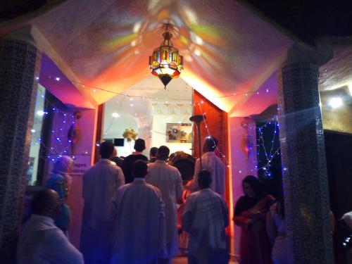 a group of people standing in a room with lights at reda land in O Ben Slimane