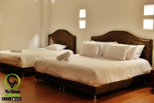 Ένα ή περισσότερα κρεβάτια σε δωμάτιο στο Hotel Puente Piedra