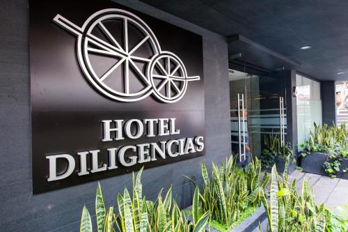 a hotel sign on the side of a building at Hotel Diligencias in Mexico City