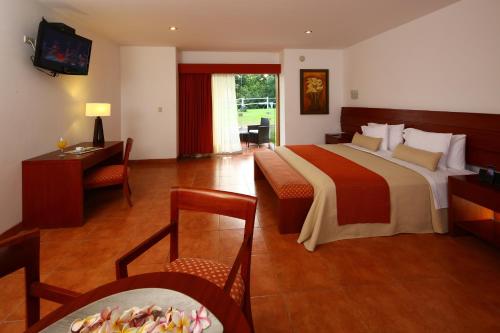 Postel nebo postele na pokoji v ubytování Hotel Las Dunas