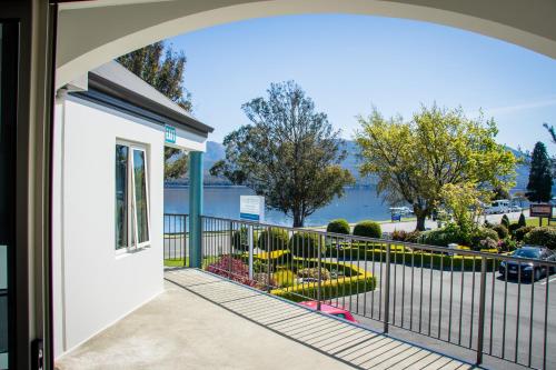 a balcony with a view of the water at Radfords on the Lake in Te Anau