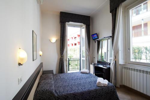Postel nebo postele na pokoji v ubytování Hotel Brenta Milano