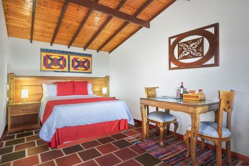Postel nebo postele na pokoji v ubytování Hotel Zocalo Campestre