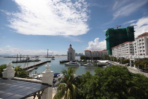 a view of a harbor with boats in the water at The Straits Quay Marina by Messina Clive in George Town