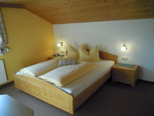 a bedroom with a large bed in a room at Ferienhaus Höchhäusl in Werfenweng