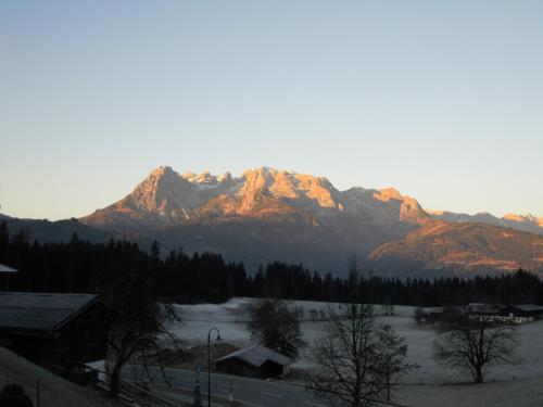a view of a mountain range with snow and trees at Ferienhaus Höchhäusl in Werfenweng