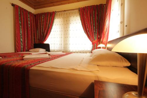 Katil atau katil-katil dalam bilik di Konya Dervish Hotel