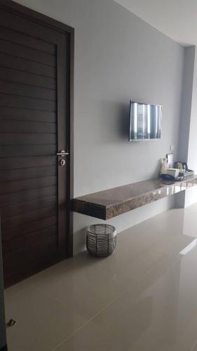 a room with a door and a counter with a sink at VST Residence -SHA PLUS Certified in Ban Khlong Bang Ping